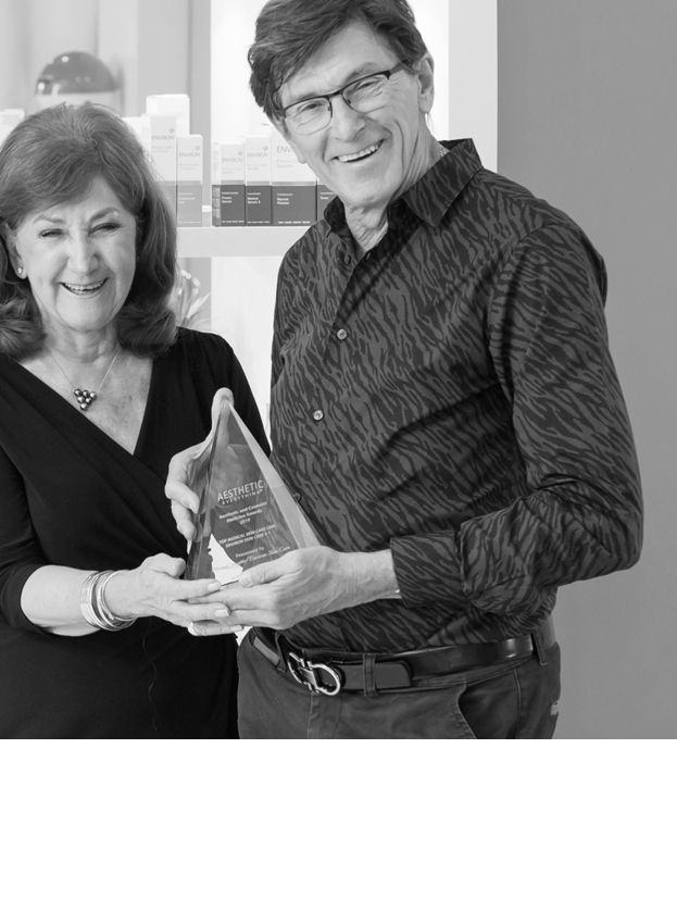 Dr Des with award
